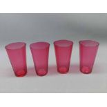 Four cranberry beakers