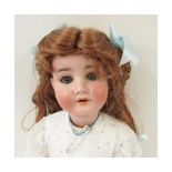 German bisque socket head doll, with weighted blue sleep glass eyes, lashes attached, painted