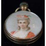 Unusual Edwardian gilt metal framed pendant in the form of a toy "fob-watch" with "winder", To the