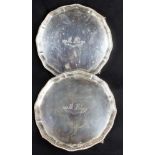 Pair of late Victorian silver wine salvers in George II style of shaped circular form with gadrooned
