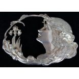 Large Art Nouveau cast silver belt buckle of shaped oval design, pierced and embossed with a cameo