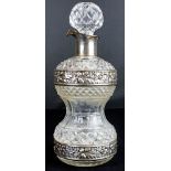 Unusual Edwardian cut-glass and silver mounted spirit decanter of hour-glass form, having applied