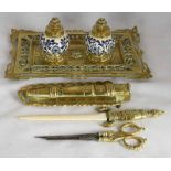 Victorian cast and pierced brass inkstand of shaped rectangular form holding to the centre, two