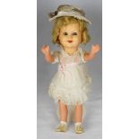 Sonja Henie English composition doll circa 1930, weighted blue glass eyes, open mouth, dimpled