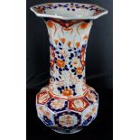 Japanese Meiji period tall octagonal baluster vase decorated in traditional colours, 33cm tall