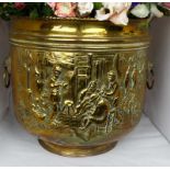 Large 20th Century brass log container or jardini re with two lion mask ring handles, embossed