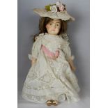 Early paint-over bisque shoulder-headed doll, possibly English, Brown hair, painted features,