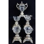 Set of five 19th Century French silver based pedestal condiments comprising: Four standing salts and