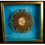 Cased 19th Century miniature watercolour of flowers within an ornate gilded and 'jewelled' scroll