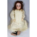 Late 19th Century porcelain headed child doll, impressed "15.79 DEP", brown sleeping eyes, pierced