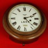 Of Railway Interest - a small early 20th Century circular mahogany cased waiting room timepiece with