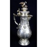 Late 19th Century Continental small baluster, silver lidded ewer, applied with winged masks and