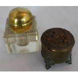 Edwardian bevelled, square glass inkwell, the hinged brass lid formed as a jockey's cap, 5 1/2 cm