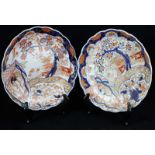 Pair of Japanese Meiji period Imari porcelain plates, of shaped circular form, decorated in