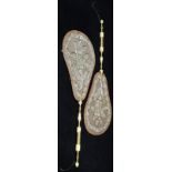 Pair of Victorian hand-held face screens, the pear shaped panels with foliate beadwork designs (silk