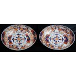 Pair of Japanese Meiji period oval Imari bowls, with scalloped rims, painted with floral designs