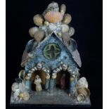 19th Century 'Hygrometer or weather house' constructed of card to a wooden base, shell encrusted,
