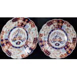 Pair of late 19th/early 20th Century Japanese Imari chargers, of scalloped circular form, painted in