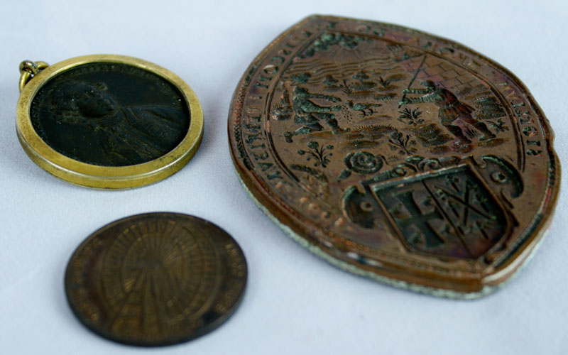 Bronze and lead backed seal of Thomas Dove, Bishop of Peterborough 1601, of lozenge shape, 8 1/2