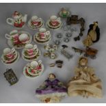 Collection of miniature doll's house items including tea wares, candlesticks, bird cage, transport