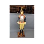 Shudehill brightly painted large model of a standing infantryman with sword raised, 28 high