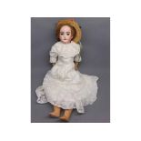 Armand Marseille head and shoulder doll, in white flowing christening type gown and straw hat,