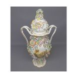 19th century floral encrusted double-handled vase, decorated with central painted panels, (much