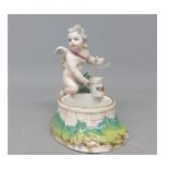 Small Berlin novelty stand, formed as a cherub by a well, 4 high