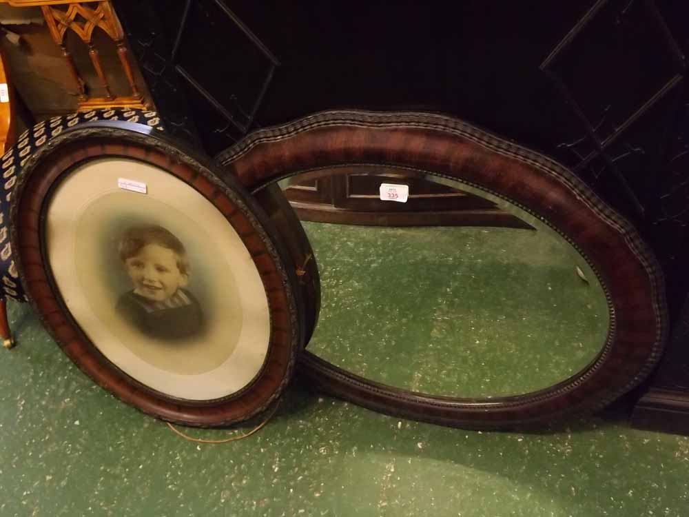 Mixed lot: an Edwardian oval wall mirror together with an oval framed vintage photograph of a boy (