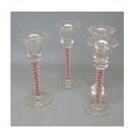 Set of four antique air twist stemmed glasses, one with the bowl engraved with grape and vine leaf