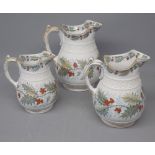 Graduate set of three Davenport Holly pattern jugs