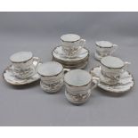 Japanese eggshell set of six cups and saucers, decorated with mountain scenes