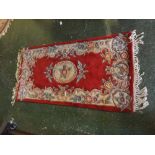 Chinese thick pile wool wash red ground and floral bordered carpet, with tasselled edge, 30 x 60