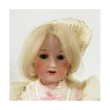 Armand Marseille 390 bisque socket head doll, with weighted brown sleep glass eyes, painted lashes