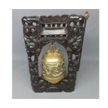 20th century Chinese brass table bell, mounted in carved hardwood stand, 15 high in total