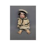 Small Armand Marseille doll, in pale and dark striped outfit, 9 high