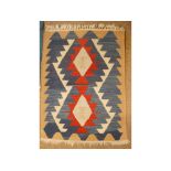 Kilim small rug and prayer mat each decorated with geometric designs on turquoise and beige ground