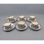 Six Victorian Ironstone cups and saucers, decorated with scenes of various figures, unsigned