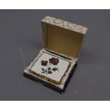 Cased Stratton musical compact, the lid decorated with rose flowers 3.25" wide