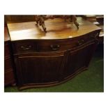 19th century mahogany serpentine front side cabinet with one long and two short drawers over two