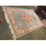 Chinese wool wash green ground thick pile carpet, with heavy floral border with oval floral multi-