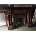 Large 19th century oak fireplace and over-mantel mirror decorated with pillared side sections and