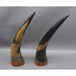 Pair of 20th century Oriental carved cow-horn sculptures decorated with rampant dragons