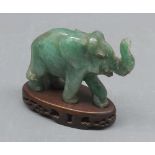 20th century carved jade elephant, and accompanying hardwood stand, elephant 4" long