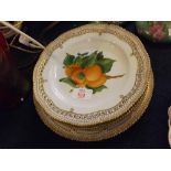 Set of four Royal Copenhagen fruit decorated cabinet plates, with pierced gilt highlighted
