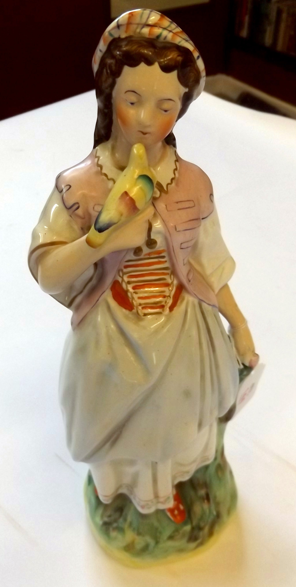 19th century Staffordshire figure, of a girl with dove perched on her right hand, wearing a puce - Image 2 of 7