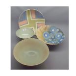 Peter Lane, group of four modern studio dishes, decorated with various abstract designs, largest 11"
