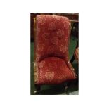 Victorian mahogany framed and red upholstered nursing chair, on turned front legs with brass and