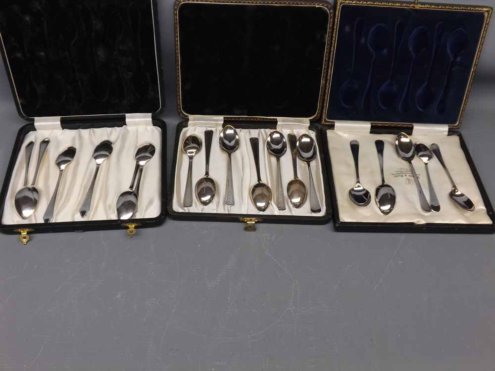 Three cases various silver teaspoons, one case with retailers marks for Barnby and Rust. various