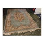 Chinese wool wash green ground thick pile carpet, with heavy floral border with oval floral multi-